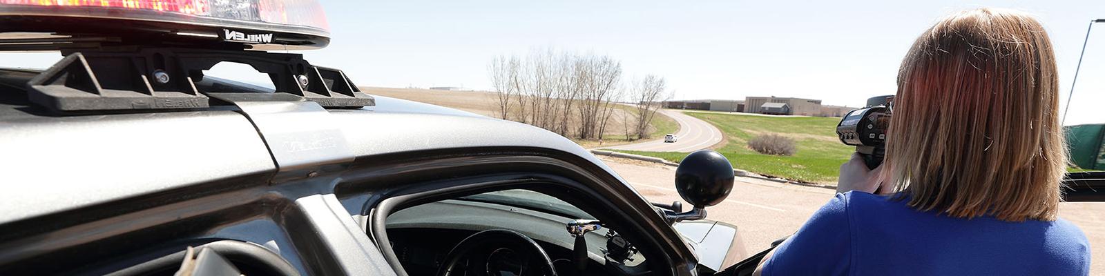 Female Law Enforcement Student taking radar